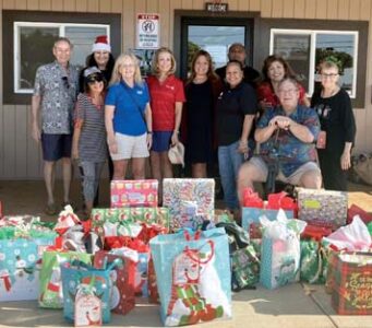 Club delivers Christmas gifts to Ka Hale A Ke Ola